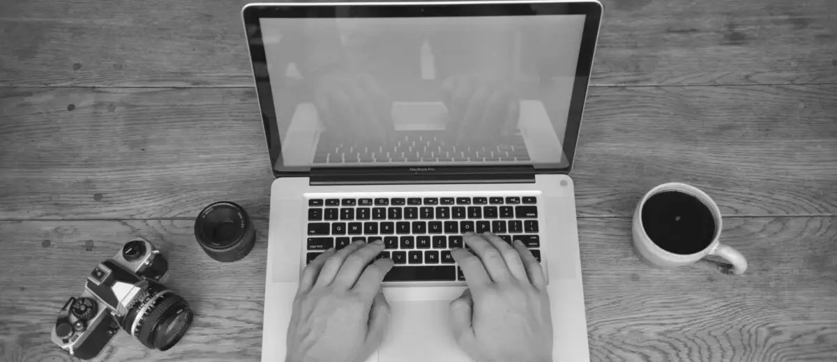 Hands on keyboard. Black and white photo.