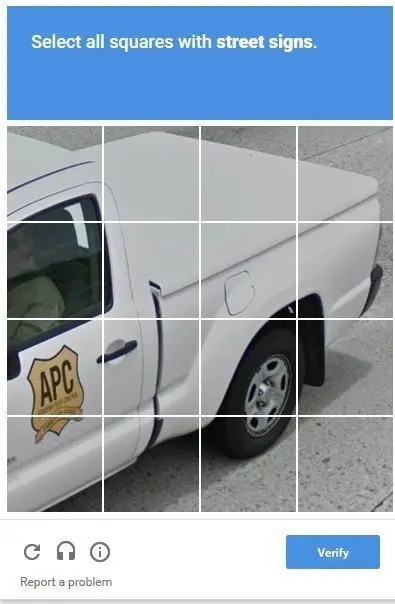 Image of car. "Select all squares with street signs."