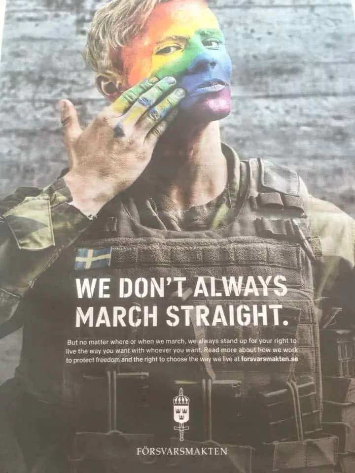 Person in the army fingerpainting rainbow on their face. Text: "We don't always march straight".