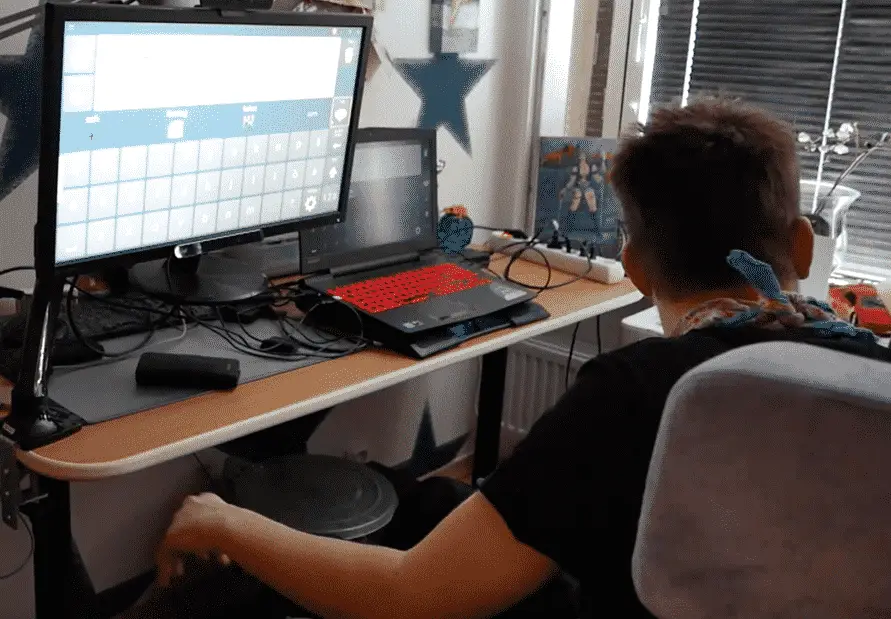 An eyetracker user typing on a big display.