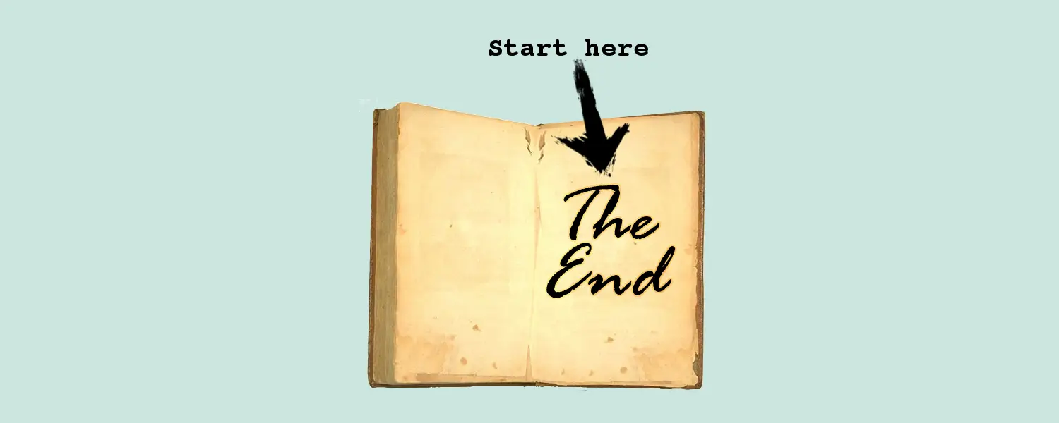 Book opened to the last page displaying "The end" and arrow pointing to it saying "Start here".